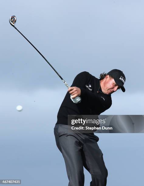Phil Mickelson hits his tee shot on the 13th hole during the first round of the AT&T Pebble Beach National Pro-Am at Monterey Peninsula Country Club...