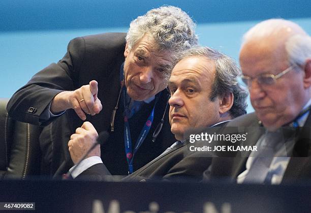 Newly re-elected UEFA president Michel Platini speaks to Angel Maria Villar Llona at the Ordinary UEFA Congress in Vienna, Austria on March 24, 2015....