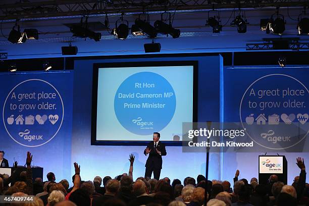 British Prime Minister David Cameron speaks to members of 'Age UK' during their election rally at the Queen Elizabeth II centre on March 24, 2015 in...