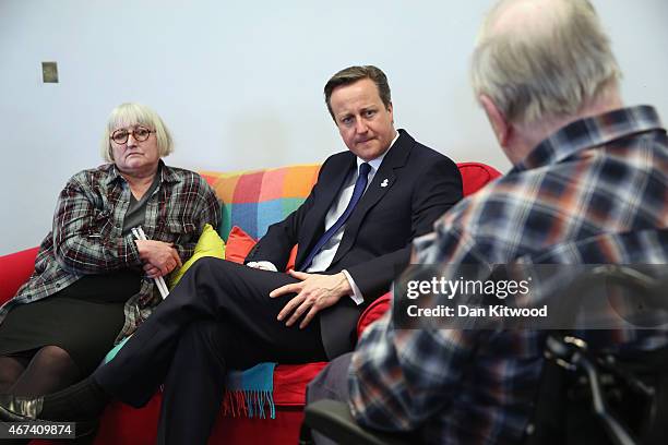 British Prime Minister David Cameron speaks to members of 'Age UK' after an election rally at the Queen Elizabeth II centre on March 24, 2015 in...