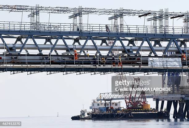 Picture taken on March 24, 2015 shows the jetty at the oil storage terminal of VTT Vasiliko Ltd at the port of Vasilikos in the coastal southern...