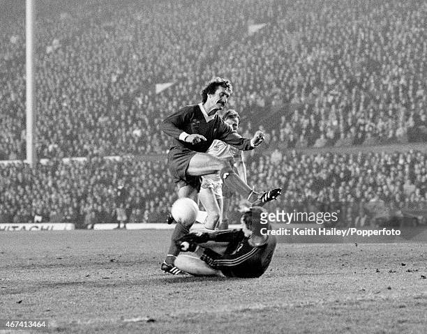 Aberdeen goalkeeper Jim Leighton bravely saves at the feet of Liverpool's Terry McDermott during the European Cup 2nd round 2nd leg match between...