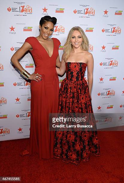 Television personality Alicia Quarles and actress AnnaSophia Robb attend Go Red For Women The Heart Truth Red Dress Collection 2014 Show Made...