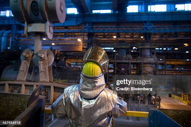 Worker wearing heat resistant clothing takes a break during the production of copper cathode sheets at the KHGM Polska Miedz SA copper smelting plant...