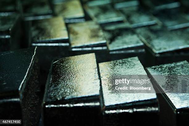 Newly cast silver bullion bars sit ahead of export at the KHGM Polska Miedz SA smelting plant in Glogow, Poland, on Monday, March 23, 2015. KGHM is...