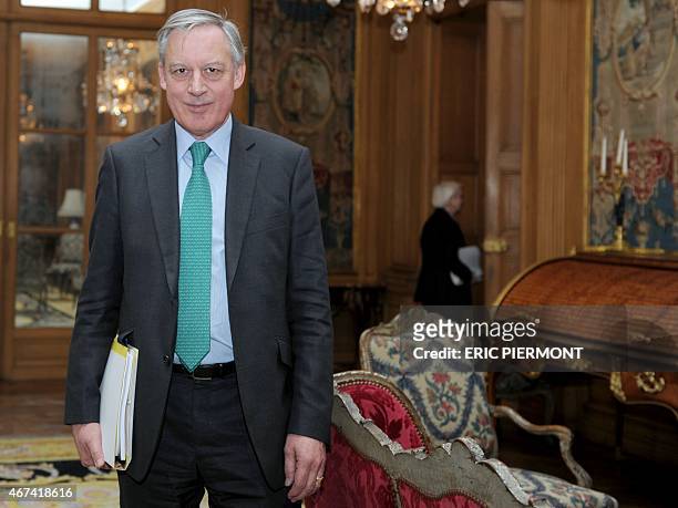 Governor of the Banque de France, the French central bank, Christian Noyer arrives to present the central bank's 2014 results at its headquarters on...