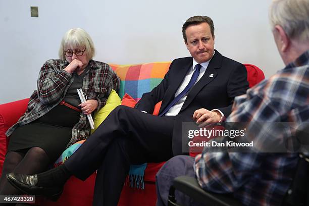 British Prime Minister David Cameron speaks to members of 'Age UK' after an election rally at the Queen Elizabeth II centre on March 24, 2015 in...