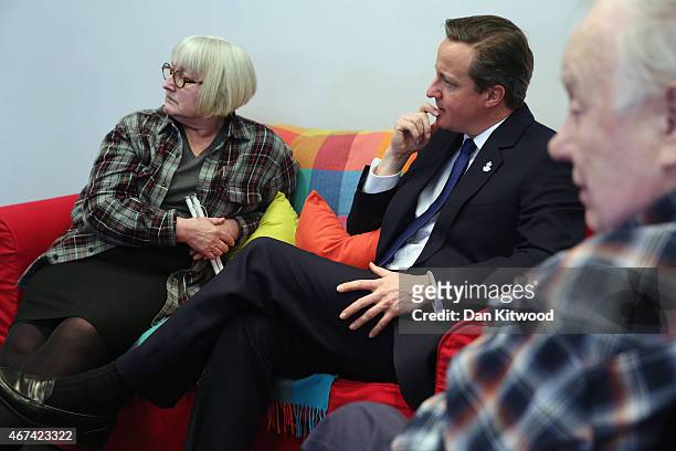 British Prime Minister David Cameron speaks to members of 'Age UK' after an election rally at the Queen Elizabeth II centre on March 24, 2015 in...