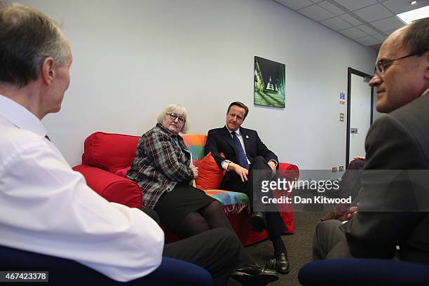 British Prime Minister David Cameron speaks to members of 'Age UK' after an election rally at the Queen Elizabeth II centre on March 24, 2015 in...