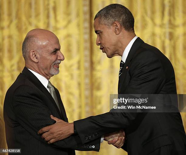 President Barack Obama and the President of Afghanistan Ashraf Ghani shake hands after holding a joint press conference in the East Room of the White...