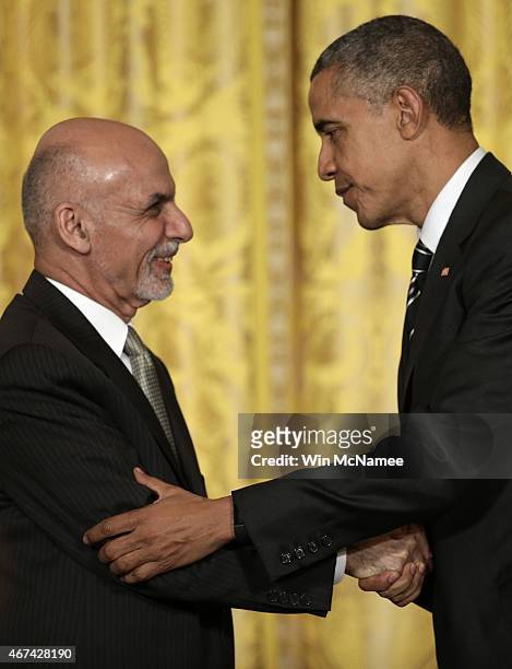 President Barack Obama and the President of Afghanistan Ashraf Ghani shake hands after holding a joint press conference in the East Room of the White...