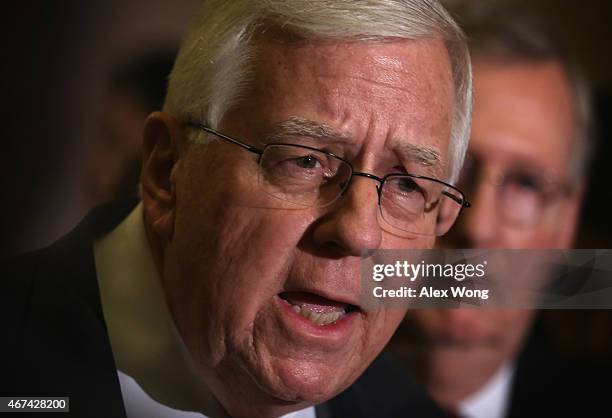 Sen. Michael Enzi speaks to members of the media as Senate Majority Leader Sen. Mitch McConnell looks on after the weekly Republican Policy Luncheon...