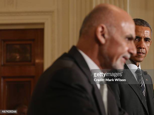 President Barack Obama listens to Afghan President Ashram Ghani speak during a news conference in the East Room at the White House on March 24, 2015...
