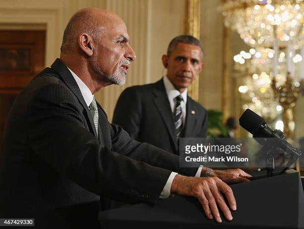 President Barack Obama listens to Afghan President Ashram Ghani speak during a news conference in the East Room at the White House on March 24, 2015...