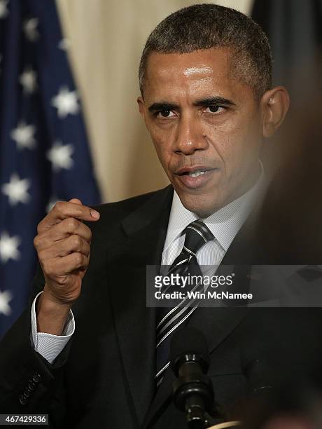 President Barack Obama answers a question while holding a joint press conference with President of Afghanistan Ashraf Ghani in the East Room of the...