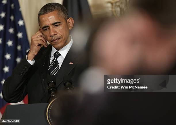 President Barack Obama listens to a question while holding a joint press conference with President of Afghanistan Ashraf Ghani in the East Room of...