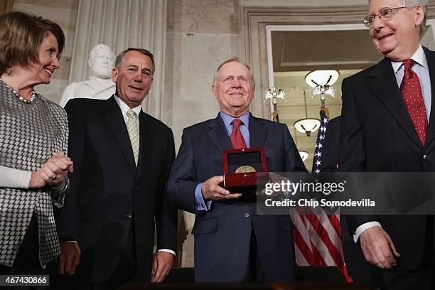 Golf legend Jack Nicklaus accepts the Congressional Gold Medal during a ceremony with House Minority Leader Nancy Pelosi , Speaker of the House John...