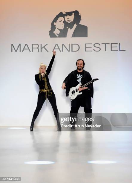 Designers Estel Day and Mark Tango pose on the runway at Mark And Estel fashion show during Mercedes-Benz Fashion Week Fall 2014 at The Salon at...