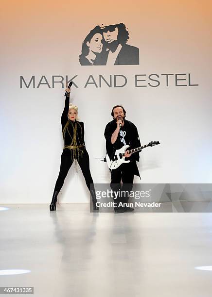 Designers Estel Day and Mark Tango pose on the runway at Mark And Estel fashion show during Mercedes-Benz Fashion Week Fall 2014 at The Salon at...
