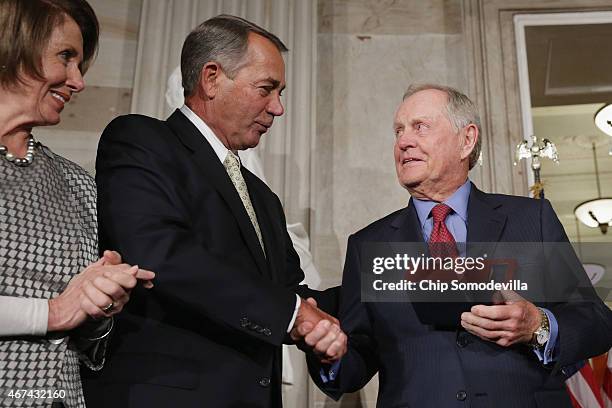 Golf legend Jack Nicklaus accepts the Congressional Gold Medal during a ceremony with House Minority Leader Nancy Pelosi and Speaker of the House...