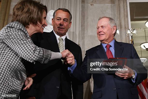 Golf legend Jack Nicklaus accepts the Congressional Gold Medal during a ceremony with House Minority Leader Nancy Pelosi and Speaker of the House...