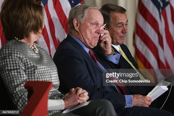 Golf legend Jack Nicklaus and Speaker of the House John Boehner wipe away tears after listening to the remarks of Nicklaus' son Jack Nicklaus II...