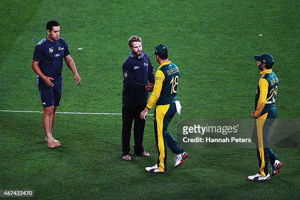 Ross Taylor of New Zealand and Kane Williamson of New Zealand shake hands with Francois du Plessis of South Africa and Farhaan Behardien of South...