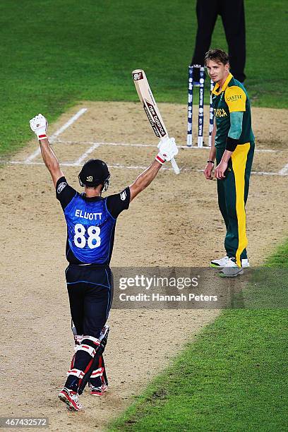 Grant Elliott of New Zealand celebrates after hitting the winning runs as Dale Steyn of South Africa looks on during the 2015 Cricket World Cup Semi...