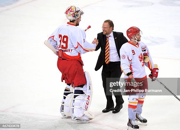 Tyler Beskorowany, coach Christof Kreutzer and Alexander Preibisch of the Duesseldorfer EG during the game between Hamburg Freezers and Duesseldorfer...