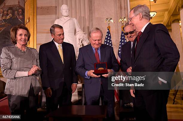 Golf legend Jack Nicklaus accepts the Congressional Gold Medal during a ceremony with House Minority Leader Nancy Pelosi , Speaker of the House John...