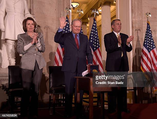 Golf legend Jack Nicklaus accepts the Congressional Gold Medal during a ceremony with House Minority Leader Nancy Pelosi , Speaker of the House John...