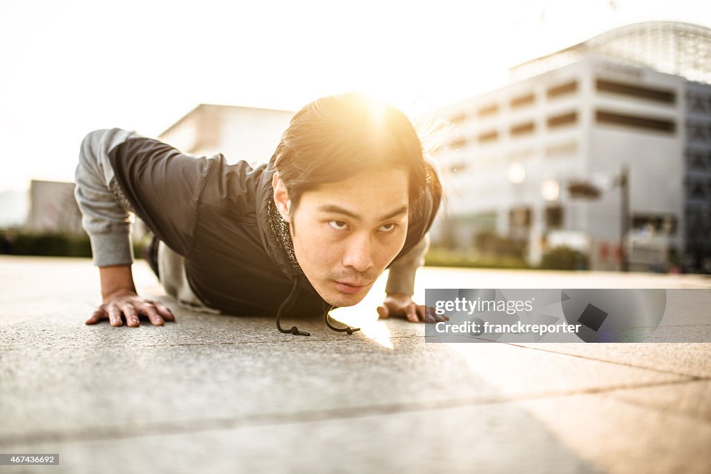 Japanese man doing push-ups