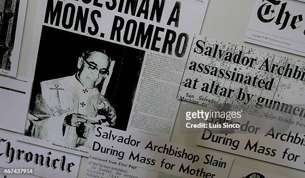 Poster bearing news stories and a likeness of Archibishop Oscar A. Romero hangs on the wall of the offices of Clinica Monsenor Oscar A. Romero March...