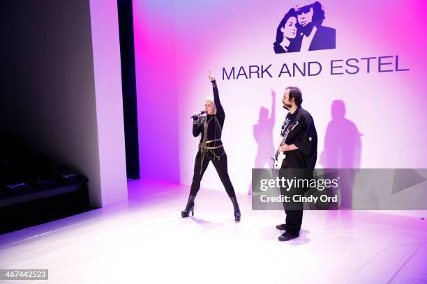 Estel Day and Mark Tango prepare backstage at the Mark And Estel fashion show during Mercedes-Benz Fashion Week Fall 2014 at The Salon at Lincoln...