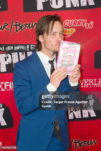 Actor Tom Schilling attends the premiere of the film 'Tod den Hippies - Es lebe der Punk!' at UCI Kinowelt on March 24, 2015 in Berlin, Germany.