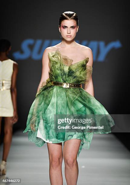 Model walks the runway wearing Vawk fall 2015 collection during World MasterCard Fashion Week Fall 2015 at David Pecaut Square on March 24, 2015 in...