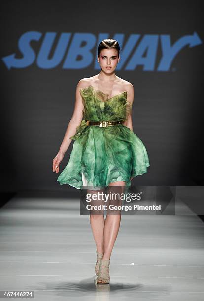 Model walks the runway wearing Vawk fall 2015 collection during World MasterCard Fashion Week Fall 2015 at David Pecaut Square on March 24, 2015 in...