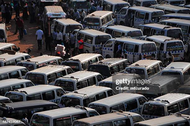 african bus station - share taxi agglomeration, kampala, uganda - kampala stock pictures, royalty-free photos & images