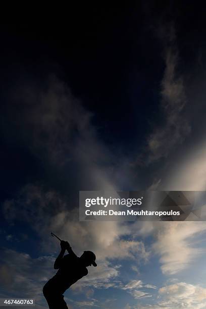 Charl Coetzee of South Africa hits a practice shot on the driving range during Day Two of the Joburg Open at Royal Johannesburg and Kensington Golf...