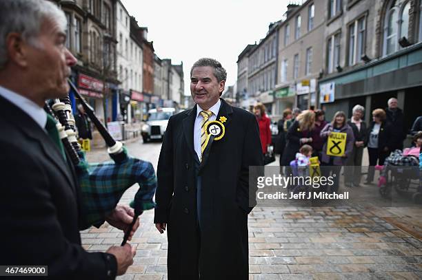 Candidate Roger Mullin, opens a general election campaign shop in the constituency of former prime minister Gordon Brown on March 24, 2015 in...