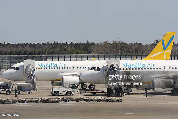 Vanilla Air aircraft sit parked at Terminal 3 of Narita Airport in Narita, Japan, on Wednesday, March 25, 2015. The airport operator Narita...