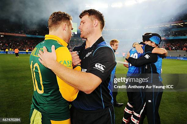 Corey Anderson of New Zealand shares a hug with David Miller of South Africa after the 2015 Cricket World Cup Semi Final match between New Zealand...