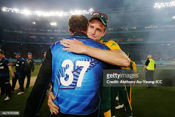 Morne Morkel of South Africa shares a hug with Kyle Mills of New Zealand after the 2015 Cricket World Cup Semi Final match between New Zealand and...
