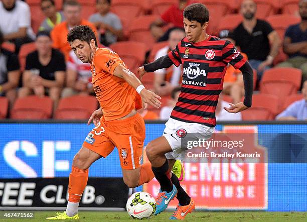 Dimitri Petratos of the Roar and Labinot Haliti of the Western Sydney Wanderers compete for the ball during the round 21 A-League match between...