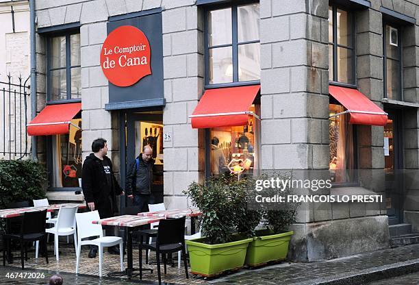 People leave "Le comptoir de Cana", a "catholic bar", on March 24, 2015 in Lille, northern France. AFP PHOTO / FRANCOIS LO PRESTI