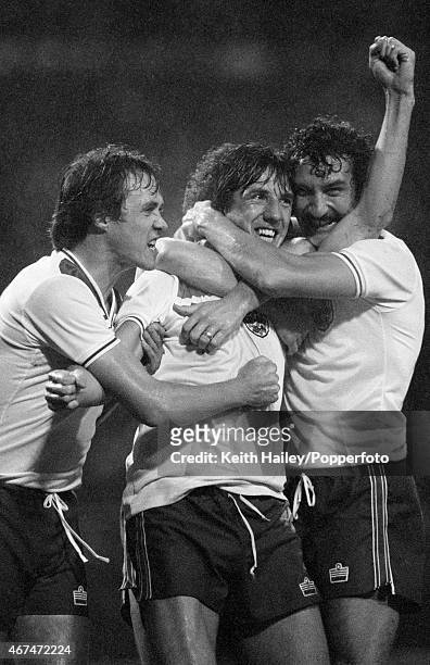 Paul Mariner celebrates with Phil Neal and Terry McDermott after scoring England's winning goal during the World Cup Qualifying match between England...