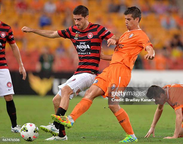 Mateo Poljak of the Western Sydney Wanderers is challenged by Andrija Kaluderovic of the Roar during the round 21 A-League match between Brisbane...