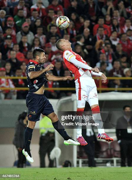 Luis Perez of Independiente Santa Fe struggles for the ball with Julian Guillermo of Independiente Medellin during a postponed match of round 6...