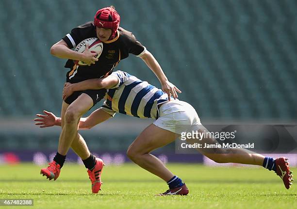 Edan Kelly of Wakefield is tackled by Will Tanner of Warwick during the NatWest Schools U15 Cup Final between Warwick School and Qegs Wakefield at...
