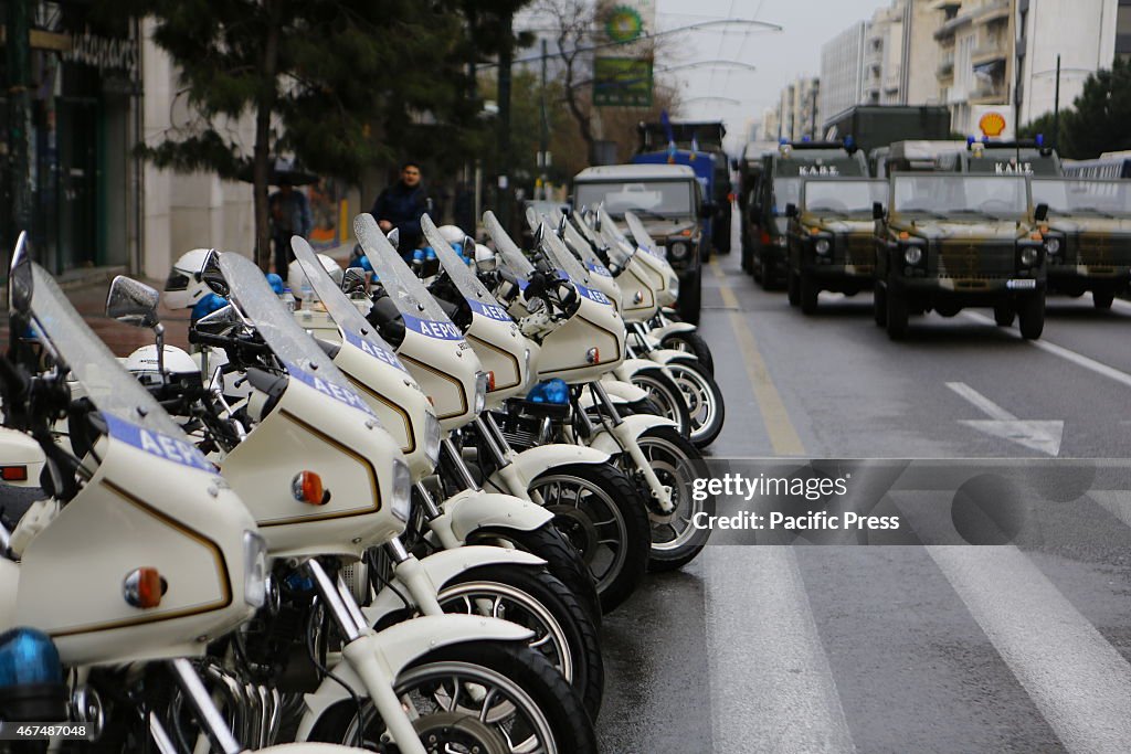 A row of police motorcycles is lined up ahead of the...